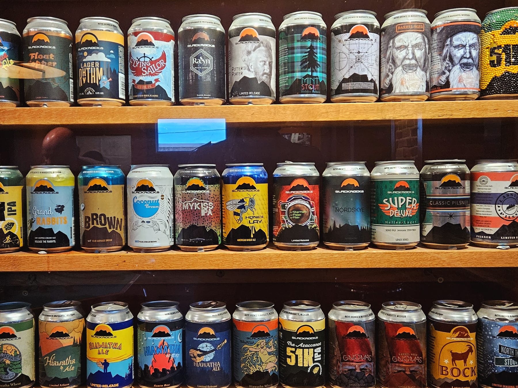 A wall of craft beer cans