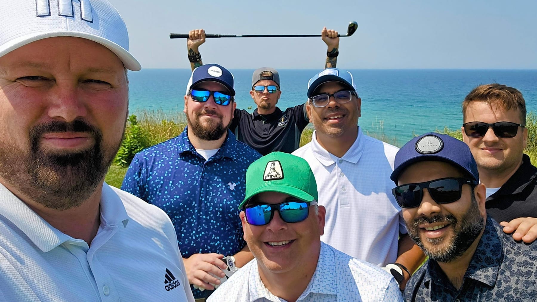 The Kings grinning on a clifftop above Lake Michigan