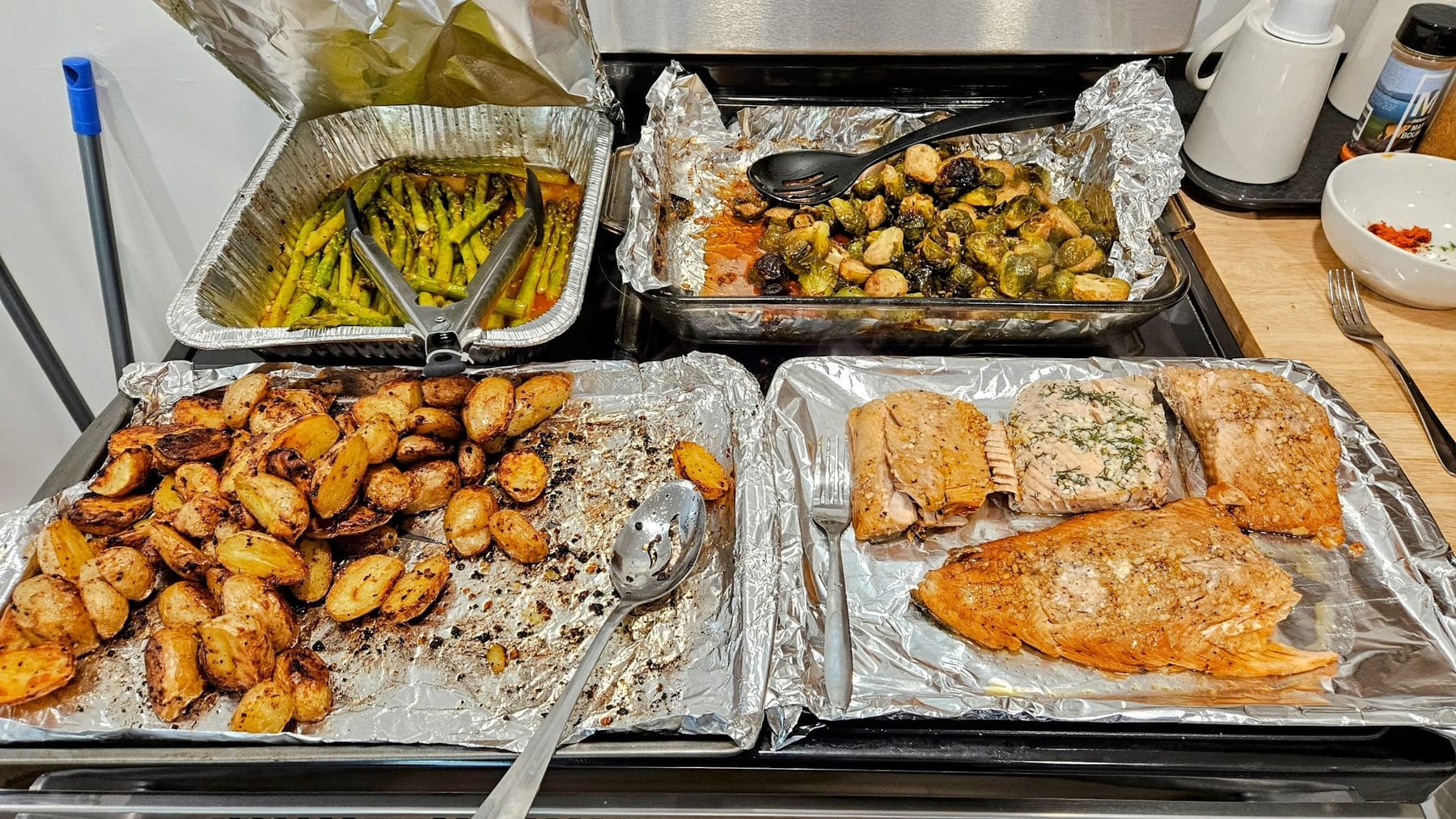 Trays of grilled potatoes, fish and vegetables